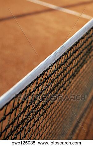 Stock Photography - High angle view of a tennis net on a tennis court. Fotosearch