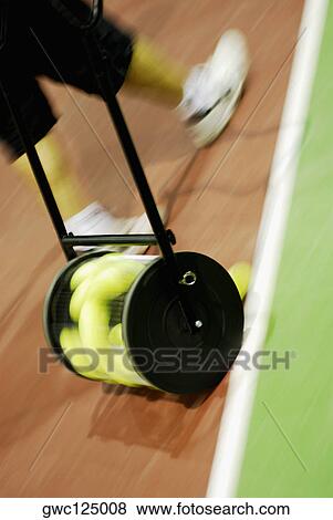 Low section view of a person walking on a tennis court View Large Photo Image Stock Photo - Low section view of a person walking on a tennis court. Fotosearch