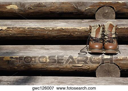 Stock Photo - Pair of shoes on wooden steps. Fotosearch