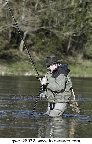 Side profile of a mature man fishing in the river View Large Photo Image Stock Image - Side profile of a mature man fishing in the river. Fotosearch