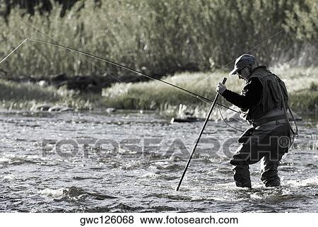 Side profile of a mature man fishing in the river View Large Photo Image Stock Photo - Side profile of a mature man fishing in the river. Fotosearch
