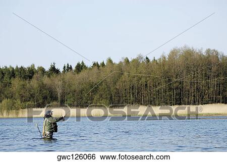 Side profile of a mature man fishing in the river View Large Photo Image Stock Photograph - Side profile of a mature man fishing in the river. Fotosearch