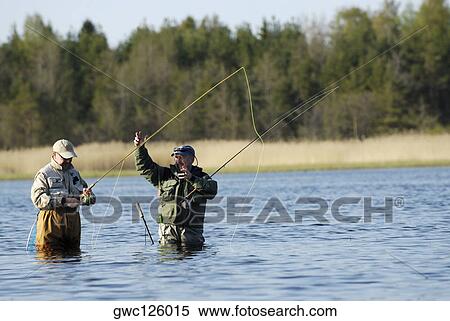 Two senior men fishing in the river View Large Photo Image Stock Photography - Two senior men fishing in the river. Fotosearch