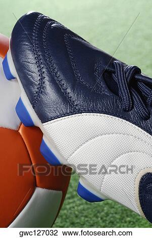Close-up of a soccer shoe and a soccer ball View Large Photo Image Stock Image - Close-up of a soccer shoe and a soccer ball. Fotosearch
