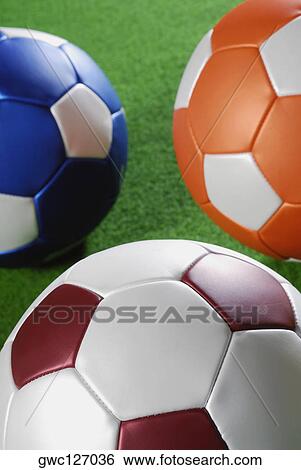Stock Photograph - Close-up of three soccer balls. Fotosearch
