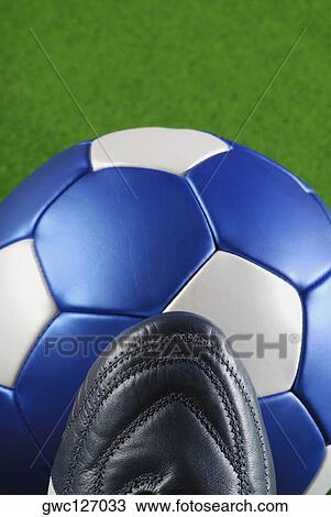 High angle view of a soccer shoe and a soccer ball View Large Photo Image Stock Image - High angle view of a soccer shoe and a soccer ball. Fotosearch