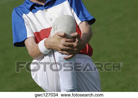 Mid section view of a boy warming up View Large Photo Image Picture - Mid section view of a boy warming up. Fotosearch