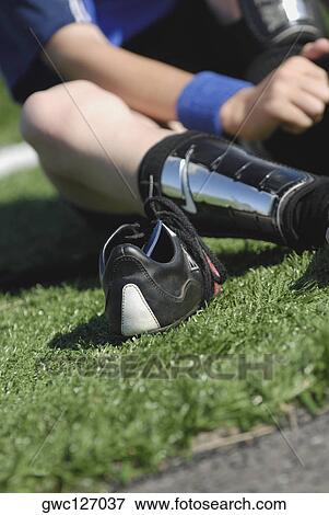 Mid section view of a soccer player wearing socks View Large Photo Image Stock Photo - Mid section view of a soccer player wearing socks. Fotosearch