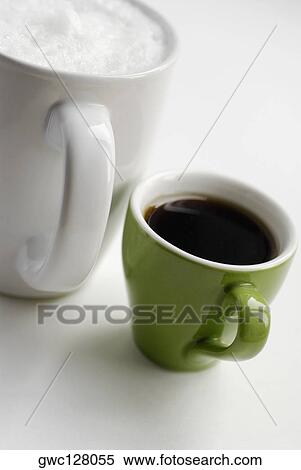 Close-up of a cup of black tea with a mug of coffee View Large Photo Image Stock Photography - Close-up of a cup of black tea with a mug of coffee. Fotosearch
