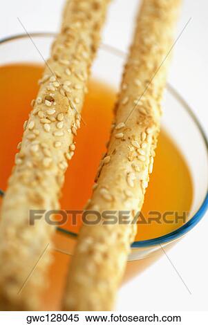 Close-up of breadsticks on a bowl of soup View Large Photo Image Stock Photography - Close-up of breadsticks on a bowl of soup. Fotosearch