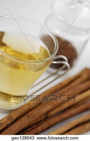 Close-up of herbal tea with breadsticks View Large Photo Image Stock Image - Close-up of herbal tea with breadsticks. Fotosearch