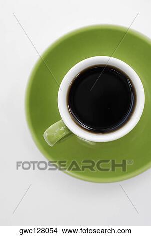 Picture - High angle view of a cup of black tea on a saucer. Fotosearch