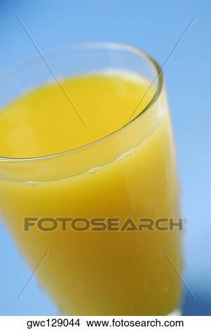 Close-up of a glass of orange juice View Large Photo Image Picture - Close-up of a glass of orange juice. Fotosearch