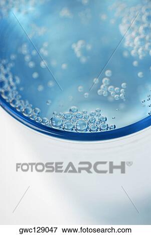 Close-up of bubbles in soda View Large Photo Image Stock Photo - Close-up of bubbles in soda. Fotosearch