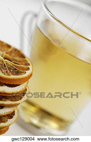 Close-up of lemon slices and a cup of herbal tea View Large Photo Image Picture - Close-up of lemon slices and a cup of herbal tea. Fotosearch