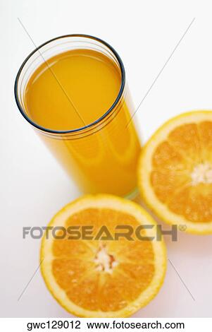 High angle view of a glass of juice with lemon slices View Large Photo Image Stock Image - High angle view of a glass of juice with lemon slices. Fotosearch