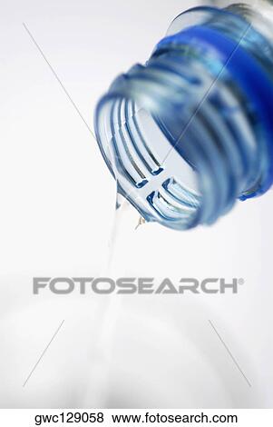 Water pouring from a bottle View Large Photo Image Stock Photo - Water pouring from a bottle. Fotosearch