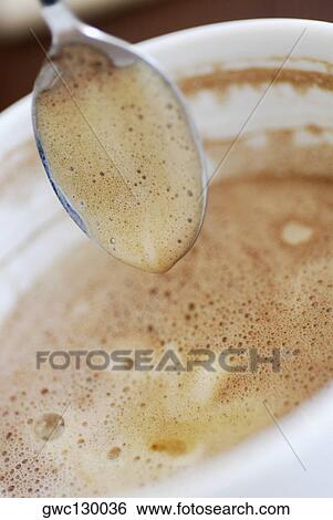 Close-up of a coffee cup and a spoon View Large Photo Image Stock Photograph - Close-up of a coffee cup and a spoon. Fotosearch