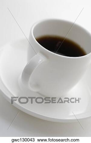 Close-up of a cup of black tea on a saucer View Large Photo Image Stock Image - Close-up of a cup of black tea on a saucer. Fotosearch