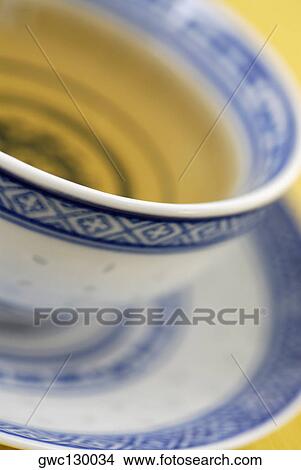 Close-up of a cup of herbal tea on a saucer View Large Photo Image Picture - Close-up of a cup of herbal tea on a saucer. Fotosearch