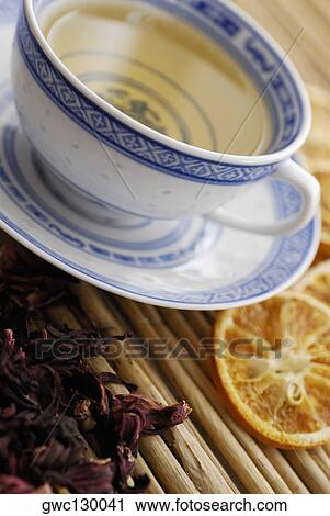 Close-up of a cup of herbal tea with dry herbal leaves View Large Photo Image Stock Image - Close-up of a cup of herbal tea with dry herbal leaves. Fotosearch