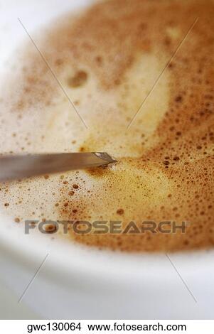 Close-up of a teaspoon in a cup of coffee View Large Photo Image Picture - Close-up of a teaspoon in a cup of coffee. Fotosearch