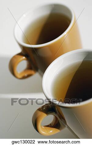 Close-up of two cups of black tea View Large Photo Image Stock Image - Close-up of two cups of black tea. Fotosearch