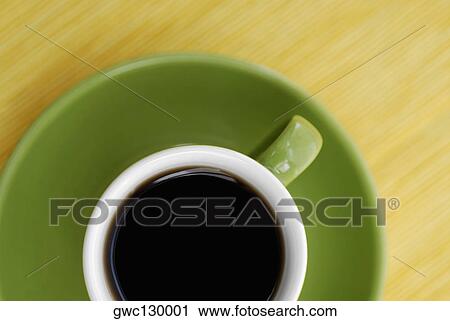 High angle view of a cup of black tea on a saucer View Large Photo Image Stock Image - High angle view of a cup of black tea on a saucer. Fotosearch