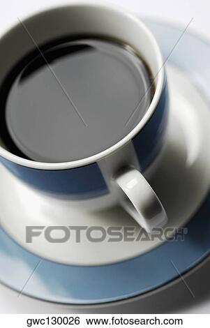 High angle view of a cup of black tea on a saucer View Large Photo Image Stock Photograph - High angle view of a cup of black tea on a saucer. Fotosearch