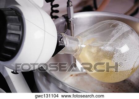 Picture - Close-up of a flask attached to laboratory equipment. Fotosearch
