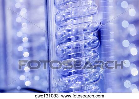 Stock Image - Close-up of a spiral glass tube. Fotosearch