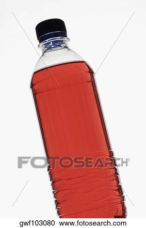 Close-up of a bottle of red liquid View Large Photo Image Stock Image - Close-up of a bottle of red liquid. Fotosearch