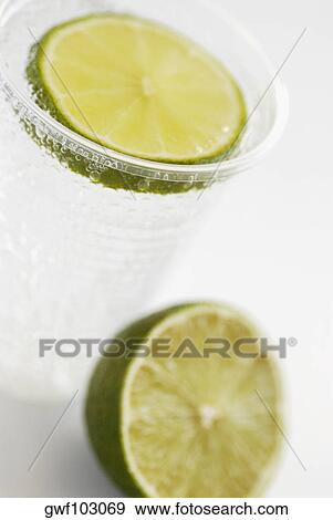 Close-up of lemonade with a slice of lemon View Large Photo Image Stock Photo - Close-up of lemonade with a slice of lemon. Fotosearch