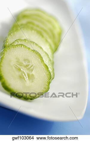 Close-up of slices of cucumber in a plate View Large Photo Image Picture - Close-up of slices of cucumber in a plate. Fotosearch