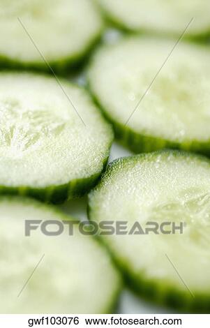 Stock Photograph - Close-up of slices of cucumber. Fotosearch