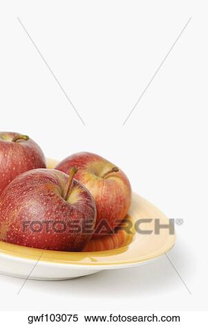 Close-up of three apples on a tray View Large Photo Image Stock Photography - Close-up of three apples on a tray. Fotosearch