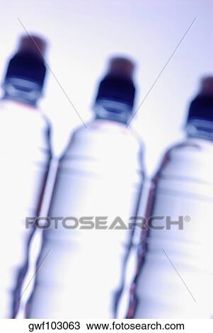 Stock Image - Close-up of three water bottles. Fotosearch
