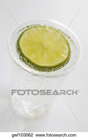 High angle view of a glass of lemonade View Large Photo Image Stock Image - High angle view of a glass of lemonade. Fotosearch