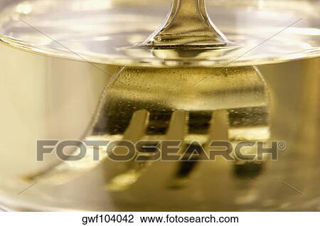 Close-up of a fork in water View Large Photo Image Stock Image - Close-up of a fork in water. Fotosearch