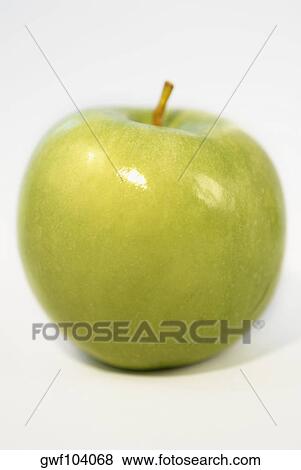 Close-up of a green apple View Large Photo Image Stock Photo - Close-up of a green apple. Fotosearch
