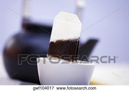 Close-up of a teabag over a cup View Large Photo Image Stock Photo - Close-up of a teabag over a cup. Fotosearch