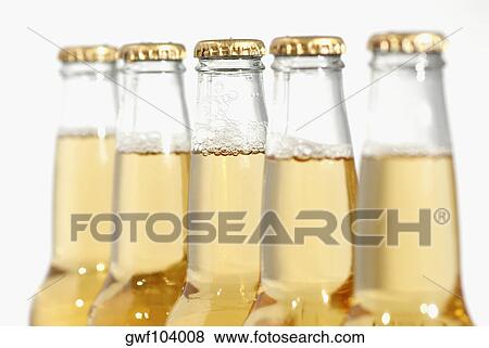 Close-up of bottles of apple juice View Large Photo Image Stock Photo - Close-up of bottles of apple juice. Fotosearch