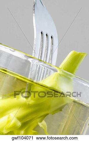 Close-up of broccoli on a fork in water View Large Photo Image Stock Image - Close-up of broccoli on a fork in water. Fotosearch