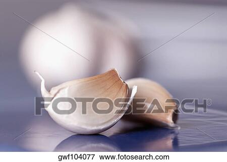 Close-up of garlic pods View Large Photo Image Stock Photo - Close-up of garlic pods. Fotosearch