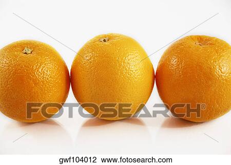 Close-up of three oranges View Large Photo Image Stock Image - Close-up of three oranges. Fotosearch