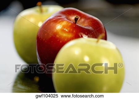 Close-up of two green apples and a red apple View Large Photo Image Stock Photography - Close-up of two green apples and a red apple. Fotosearch