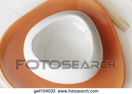 High angle view of a bowl on a plate View Large Photo Image Stock Image - High angle view of a bowl on a plate. Fotosearch