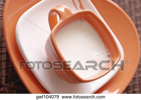 High angle view of a cup of milk View Large Photo Image Stock Photo - High angle view of a cup of milk. Fotosearch
