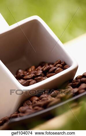 Picture - Low angle view of coffee beans in a cup. Fotosearch