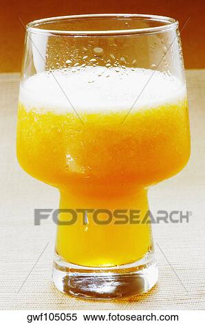Close-up of a glass of juice View Large Photo Image Stock Photography - Close-up of a glass of juice. Fotosearch